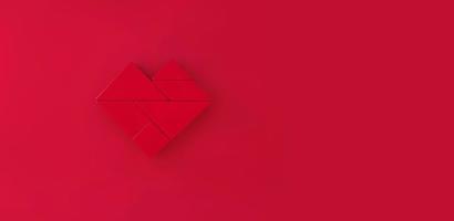 Red Heart tangram on red background. photo