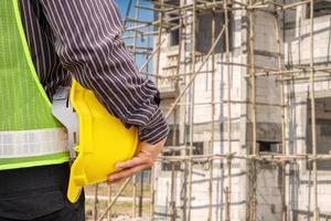 Asian business man construction engineer worker at house building site photo