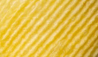 Potato chip texture background closeup photo