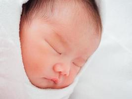 Newborn baby girl sleeping photo