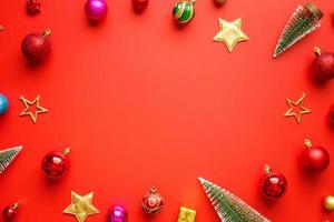 Christmas new year holiday background pine tree ball bauble on red background photo
