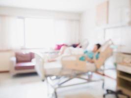 Abstract blur Patient on bed in Hospital Room interior for background photo