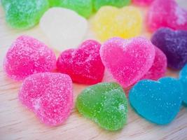colorful hearts candy on wood for valentines background photo