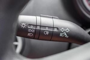Car light control switch close up photo