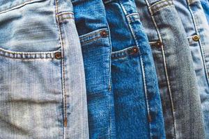 denim blue jeans stack texture background closeup photo