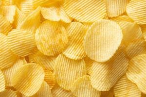 crispy golden potato chips snack texture background photo