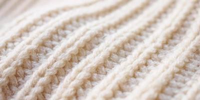 Fondo de textura de tejido de lana de punto beige de primer plano foto