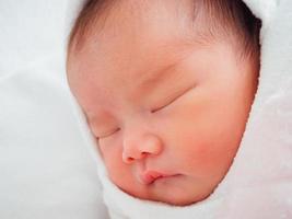 Newborn baby girl sleeping photo