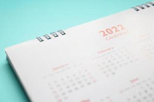 2022 calendar page on blue background business planning appointment meeting concept photo