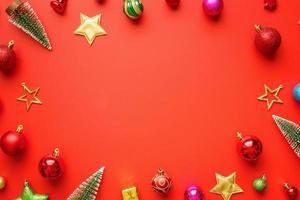 Christmas new year holiday background pine tree ball bauble on red background photo