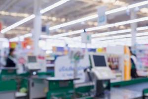 Blur cashier checkout counter in the supermarket photo