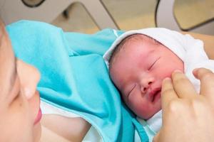 Happy Mother and Newborn Baby at the hospital photo