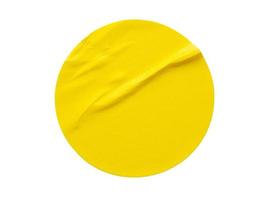 Yellow round paper sticker label isolated on white background photo