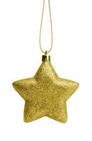 Golden Christmas star ornament bauble isolated on white background photo