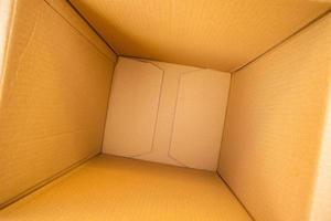 Open empty brown cardboard box background top view photo