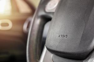 Safety airbag sign on car steering wheel photo