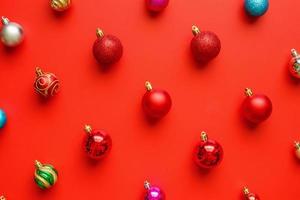 Christmas ball bauble pattern minimal flatlay on red background top view photo