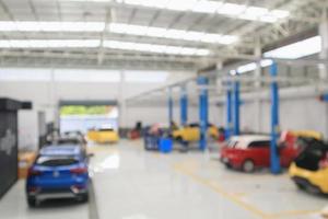 car service centre with auto at repair station bokeh light defocused blur background photo