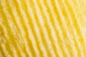 Potato chip texture background closeup photo