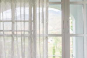 window curtain with green garden abstract blur background photo