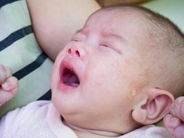 newborn baby girl crying photo