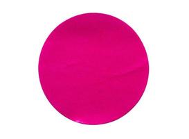 Blank pink round adhesive paper sticker label isolated on white background photo