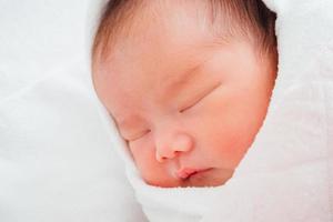 Newborn baby girl sleeping photo