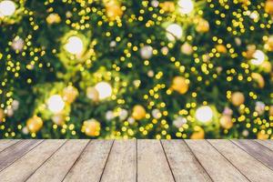 Abstract Christmas holiday bokeh light background with empty wood table for create montage product photo