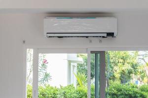 Technician install air conditioner on the wall photo
