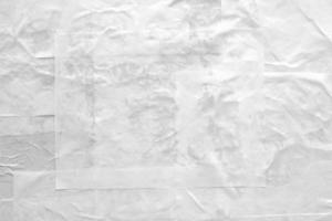 white crumpled and creased paper poster texture background photo