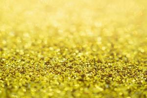 Abstract Gold glitter festive Christmas texture background blur with bokeh light photo