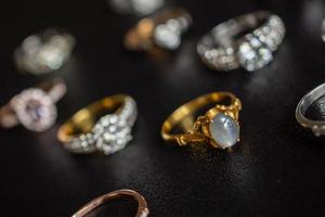 Vintage gold Jewelry blue sapphire and diamond ring on black background photo