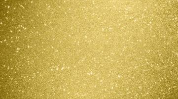 Abstract gold glitter sparkle bokeh light background photo