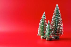 Christmas tree on red background new year  holiday celebration concept photo