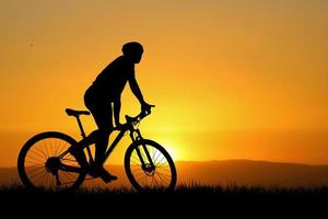 Silhouettes of bikes and cyclists travel concept and exercise by bicycle photo