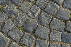 Abstract background of old cobblestone pavement photo