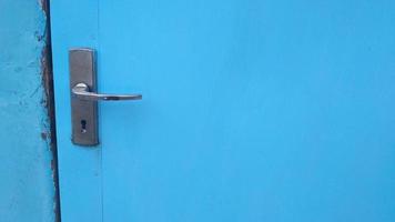 blue old door with metal handling photo