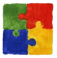 Colorful jigsaw puzzle painted background on paper sheet photo