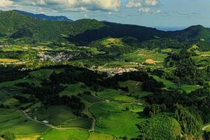 Beautiful panoramic view of the Azores island nature with green fields photo