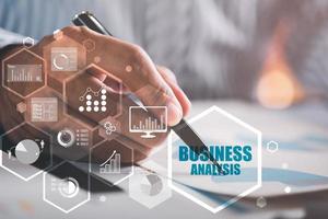 Businessmen analyze market reports with statistics from charts and graphs, managing business and financial strategies, professional analysts view investment information, consulting and presentations. photo