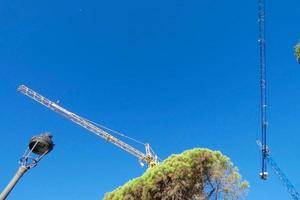 Cranes on a construction site of a building under construction photo