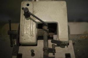 Iron lever mechanism. Old thing in garage. Steel block with lever. photo