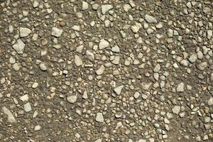 Small stone on road. Lots of stones. photo