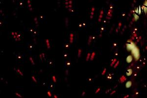 Red lights in dark. Heralds on glass. Interior details. Red dots texture. photo