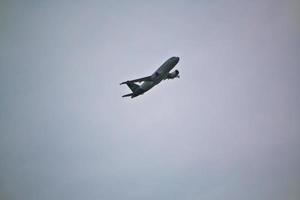 Manchester in the UK in October 2022. A Plane taking off from Manchester Airport photo