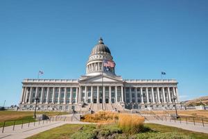 Garden at entrance of State Capitol building with clear blue sky in background photo