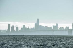 Beautiful view of Bay Bridge and skyline with clear sky in background photo