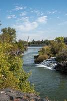 View of famous temple seen from beautiful Idaho falls with sky in background photo