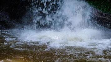 Waterfall slow motion footage, flowing water stream in a tropical rainforest in Thailand. video