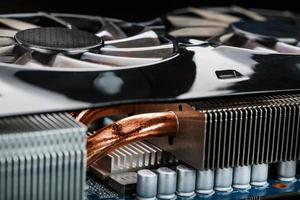 Video card with a cooling system with copper pipes, aluminum radiators and fans. photo